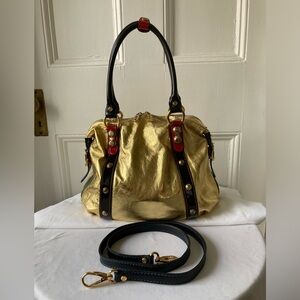Gold metallic Marino Orlandi satchel with cross-body strap.